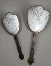 This Is A Vintage collectiable Silver-toned Ornate hand mirror/Brush