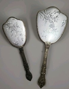 This Is A Vintage collectiable  Silver-toned Ornate hand mirror/Brush 