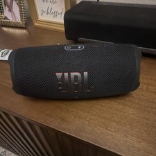 black JBL Charge 5 Portable Waterproof Speaker.
