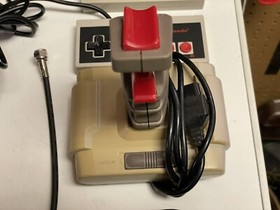 Nintendo NES console bundle with controllers, zapper, and games Tested