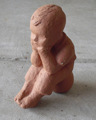 Vintage 1980s Statue Boy with Hands on Face Sitting on Ball 8'' Tall
