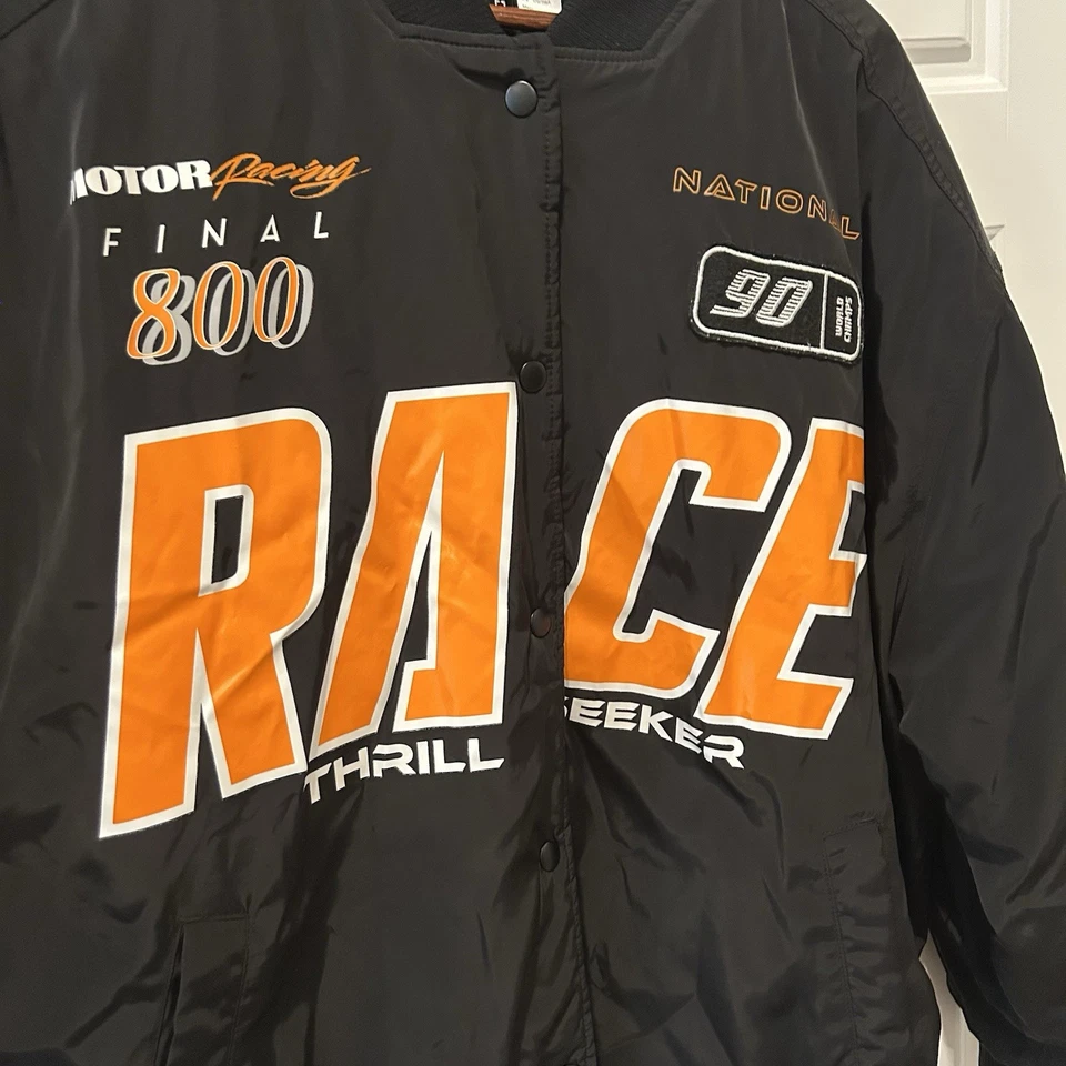 Chaqueta de bombardero H&M Divided Racer XL negra naranja gráficos XL motociclista de gran tamaño Foto 3 de 4
