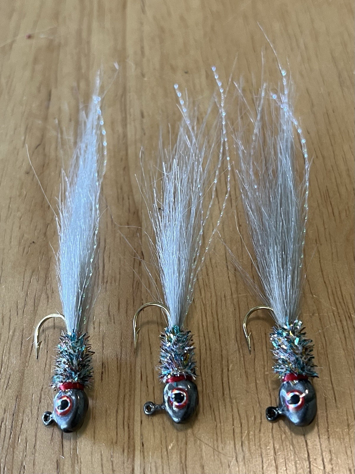 Three hand tied 1/16 crappie jigs 