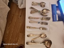 collection of different sizes an brands silver plated spoons an forks an others