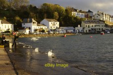 Photo 6x4 Saltash Passage A young fisherman casts his line into the water c2016