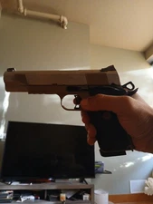 A 1911-style airsoft gun A 1911-style airsoft gun all metal