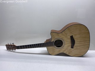 Kadence Acoustic guitar with a model number resembling A06EQ