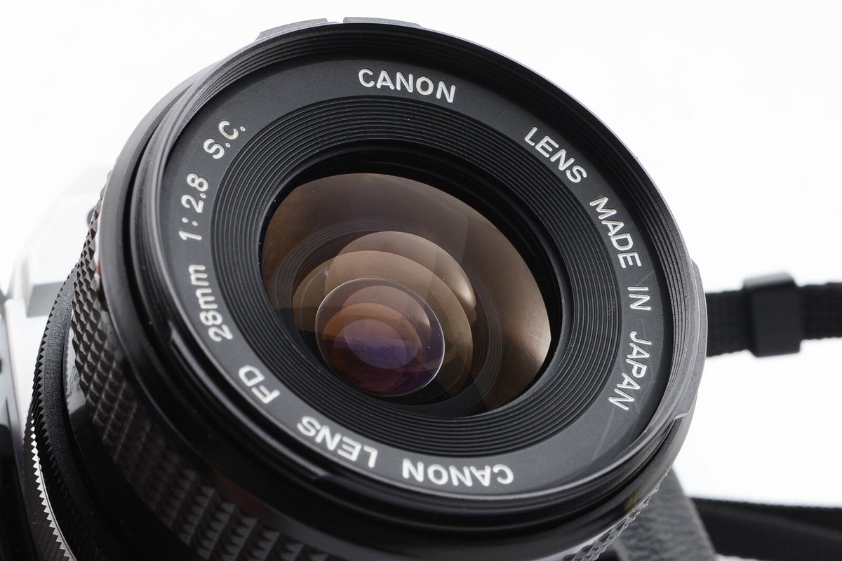 Canon AE-1 SLR Film Camera SIlver + FD 28mm f/2.8 S.C. Lens Canon AE-1 SLR Film Camera SIlver + FD 28mm f/2.8 S.C. Lens