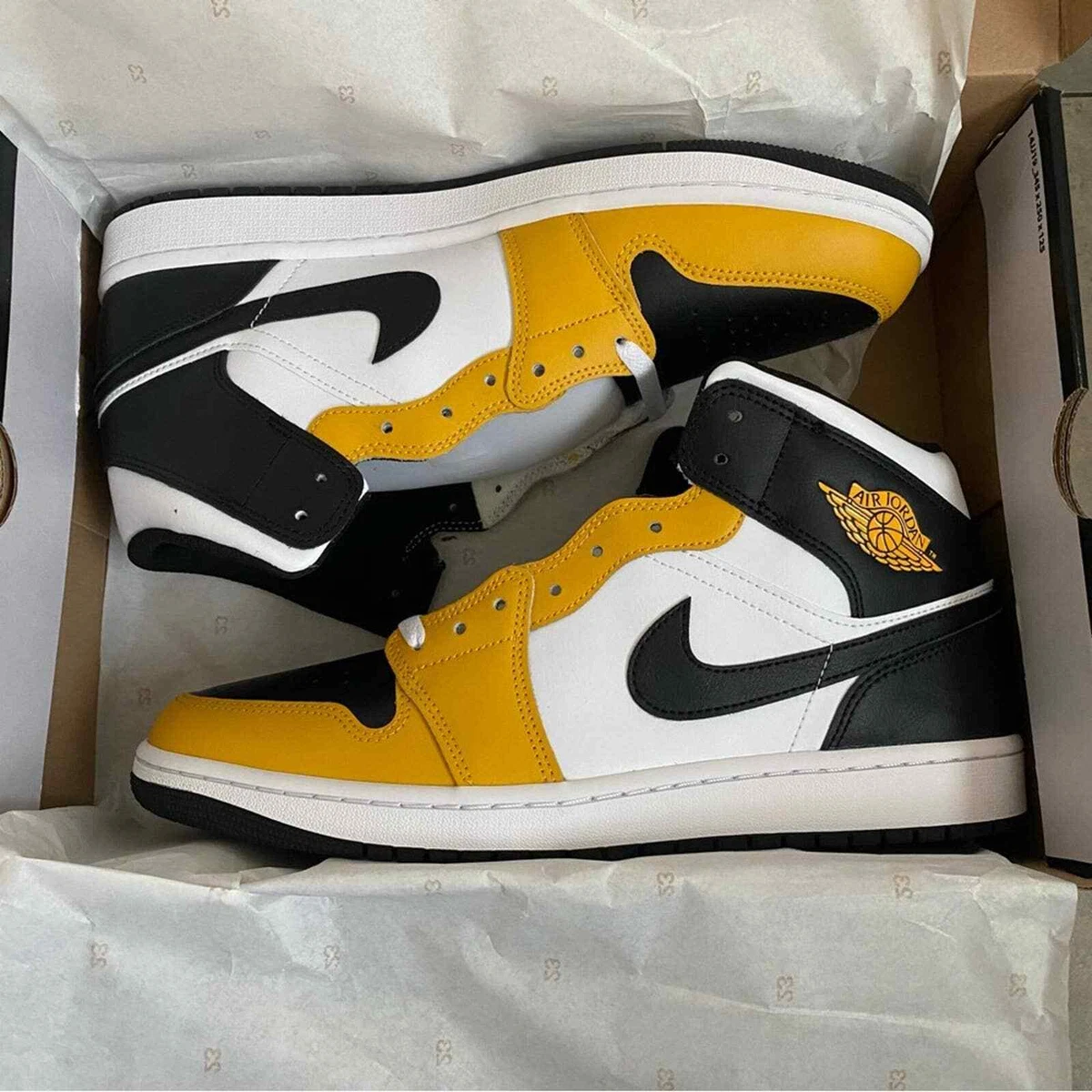 black and yellow jordan 1 mid