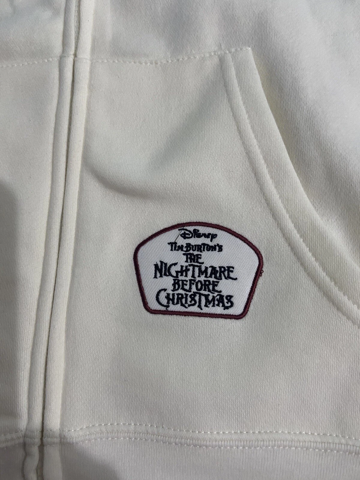 OFF WHITE FELPA CON CAPPUCCIO ZIP NUOVA CON ETICHETTE XL NIGHTMARE BEFORE CHRISTMAS JACK SKELLINGTON DISNEY con TOPPE