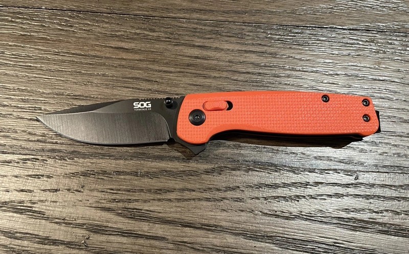 SOG Terminus XR folding Pocket Knife with Flipper & Clip Orange W/Black Blade 1