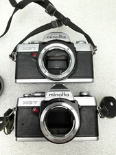 ROUGH CONDITION - PAIR OF MINOLTA XG7 SLR FILM CAMERA BODY - PARTS REPAIR