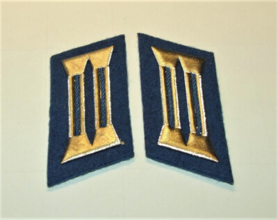 A pair of collar mirrors for masters of the GDR transport police, unworn