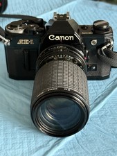 Canon AE-1 Black 35mm SLR Camera w/Sigma 80-200mm and Albinar 75-300mm Zoom Lens