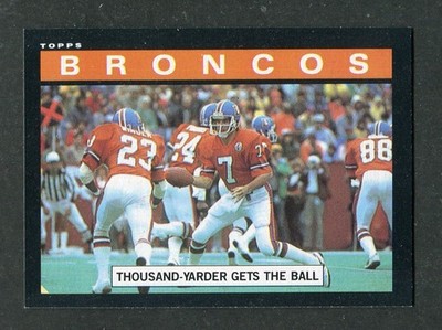 Denver Broncos Elway Thousand-Yarder Gets the Ball 1985 Topps Football Card #235