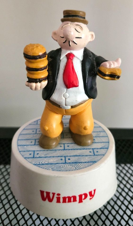 A 1989 Wimpy (from Popeye) music box figurine — a hyper-specific piece of licensed pop-culture nostalgia that still works.