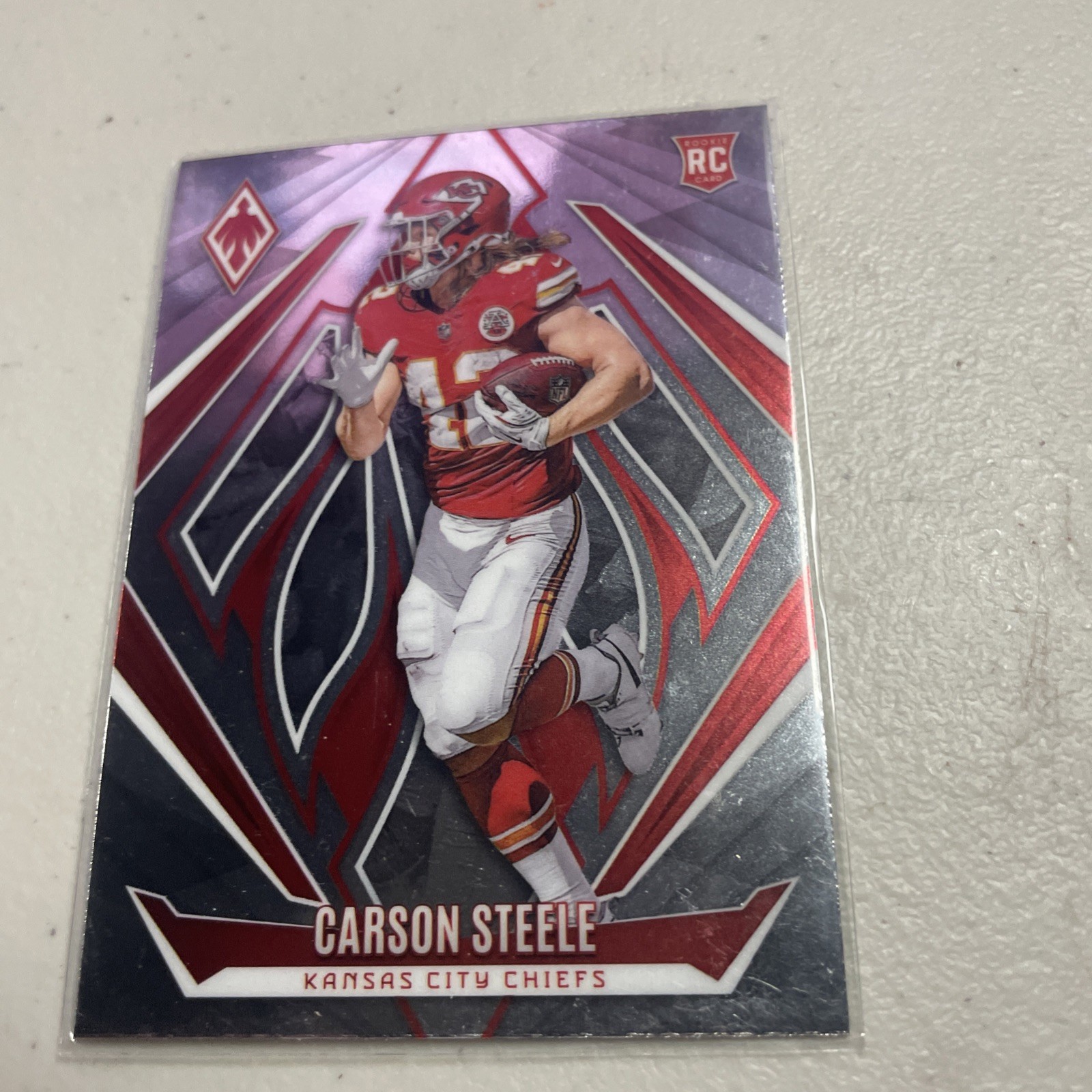2024 Panini Phoenix - Rookies Carson Steele #230 Red Fade /299 (RC)