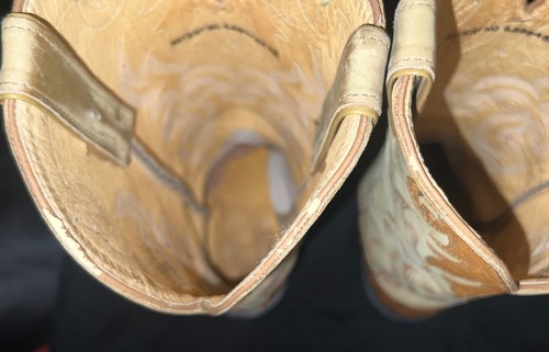 Tan leather women's full quill ostrich boots with wide square toes and stitched seams, viewed from the inside.