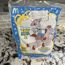 MCDONALDS TOY STORY 2 JUGUETE DISPENSADOR DE DULCES LEÑOSO Y OJO DE BUEY 1999 NUEVO EN PAQUETE