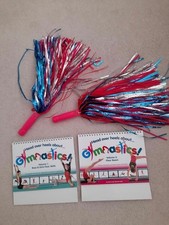 Head over Heels Gymnastics Volumes 1 and 3, plus Monsoon pom poms. Never used!