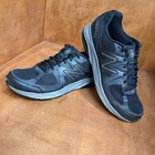 Black and gray New Balance 1540V2 men’s running shoes with silver “N” logo, mesh uppers, and made in USA text on sides.