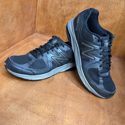 Black and gray New Balance 1540V2 men’s running shoes with silver “N” logo, mesh uppers, and made in USA text on sides.