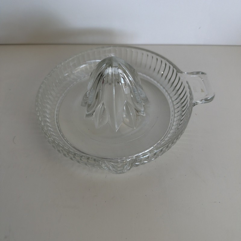 vintage clear pressed glass juicer, also known as a reamer or citrus squeezer