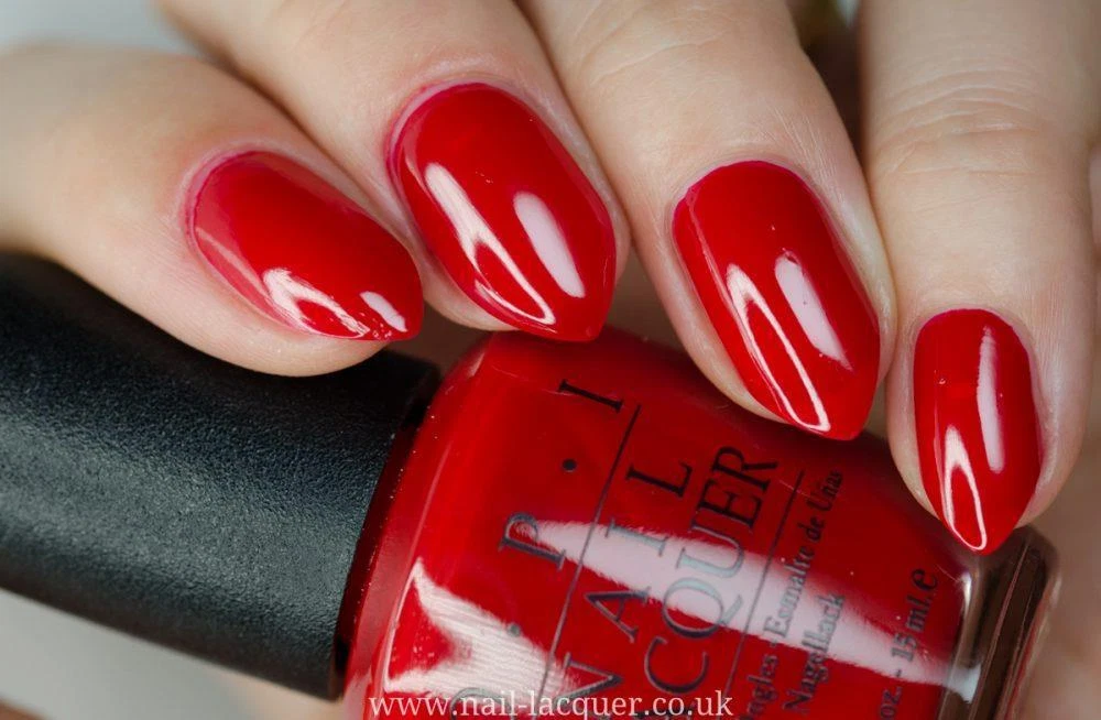 opi big apple red on dark skin