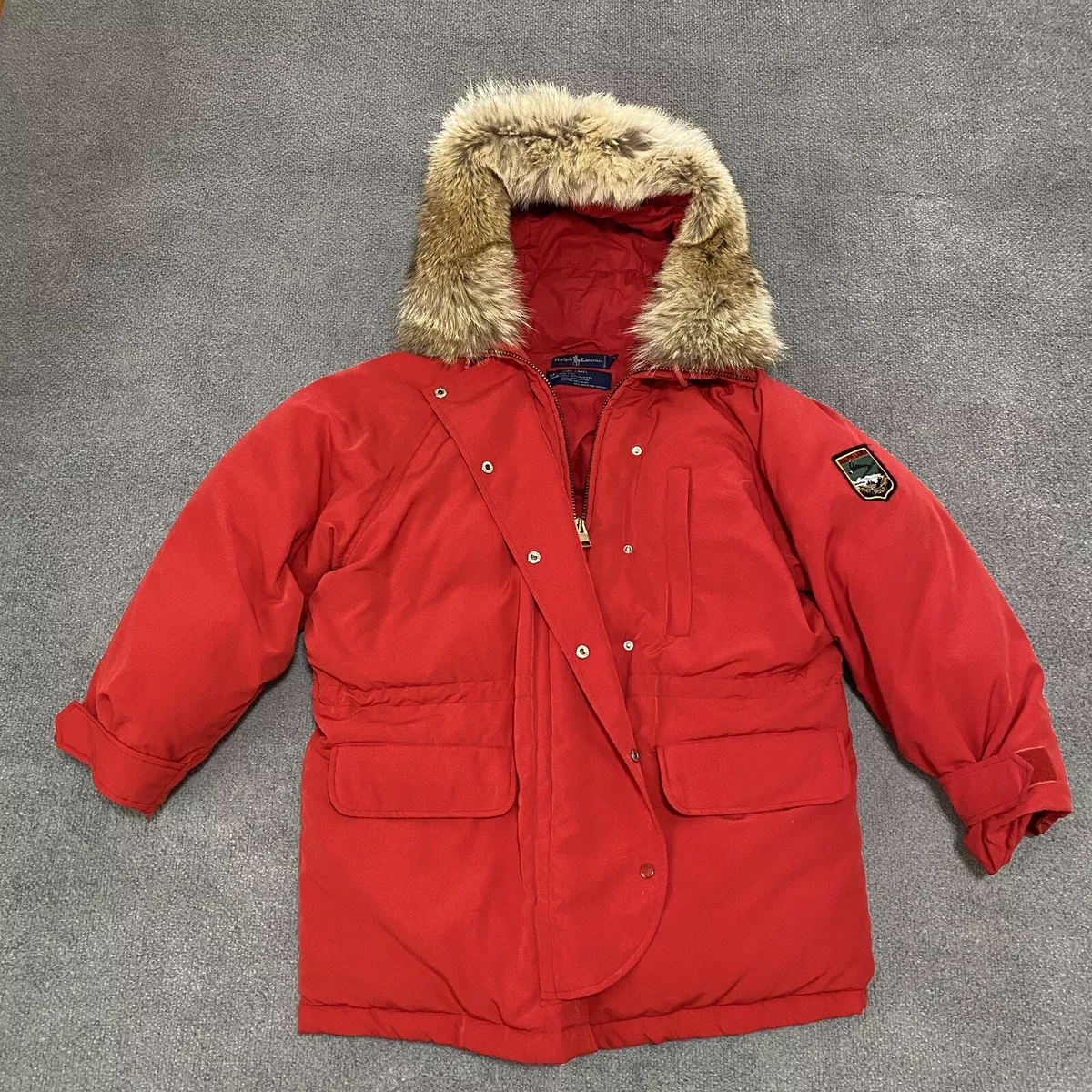 Coat with red patch on best sale arm