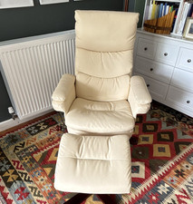 Cream Faux leather recliner and footstool set, vibrating message chair