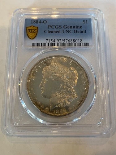 1884-O Morgan Silver Dollar $1 – PCGS Genuine UNC Details (Cleaned) –Gold Shield