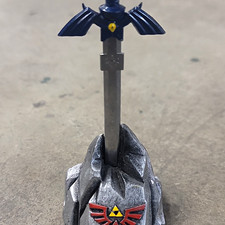 Legend of Zelda Master Sword Replica in Pedestal Display - Blue/Gray/Red/Yellow