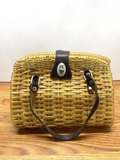 Vintage 1960s wicker basket handbag with leather straps turn clasp closure.