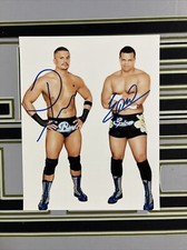 Autographed WWE 8x10 Photo Primo and Epico The Colons Blue White Background
