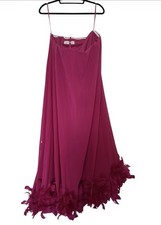 Mac Duggal strapless flared feather hem gown in the color fuchsia