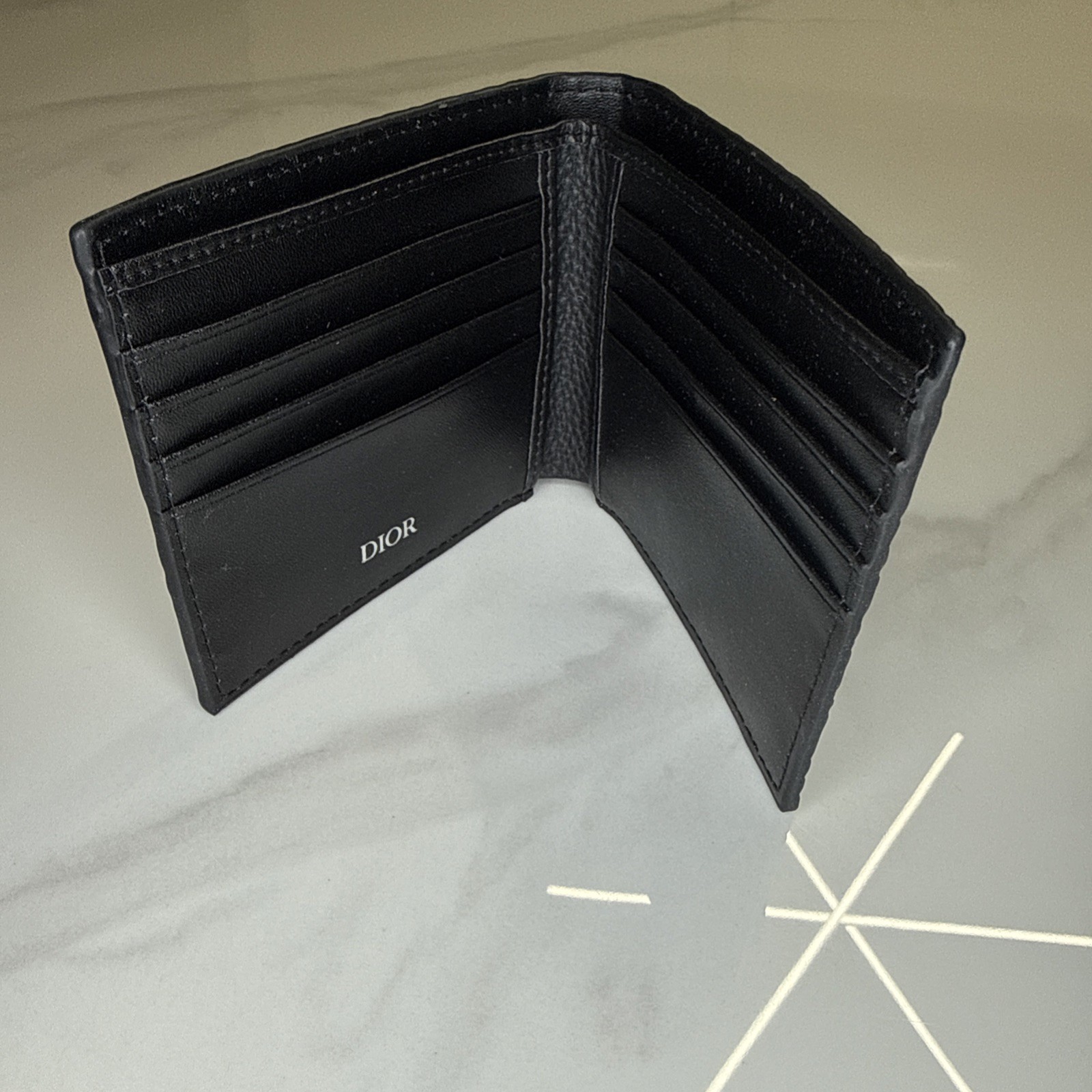 Dior Gravity Leather Bifold Wallet. embossed into premium black calfskin leather image 3
