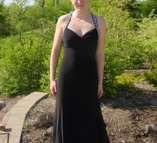 Formal evening and prom gown. Black a-line dress, low v-neck with bead ed straps