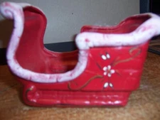 VINTAGE KIMPLE MOLD CORP. RED CERAMIC SLED WITH HANDCRAFTED SANTA DECORATION