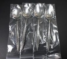 LOT OF  4 LYON ROMANESQUE STAINLESS FLATWARE.  SOUP SPOONS NEW!