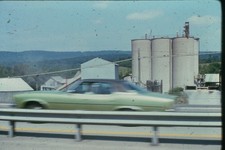 c1970's Kodachrome 35mm Slide Chevrolet Monte Carlo Coupe Industrial Silos green
