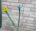 2  glass flowers 12 inches with Green stems one blue& one yellow