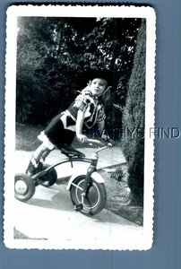 little girl on tricycle