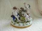 LUDWISBURG,ANTIQUE GERMAN PORCELAIN FIGURINE,CHERUBS,EARLY 19th CENTURY.