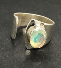 Ethiopian opal ring size N 1/2 oval natural faceted solitaire, actual one shown.