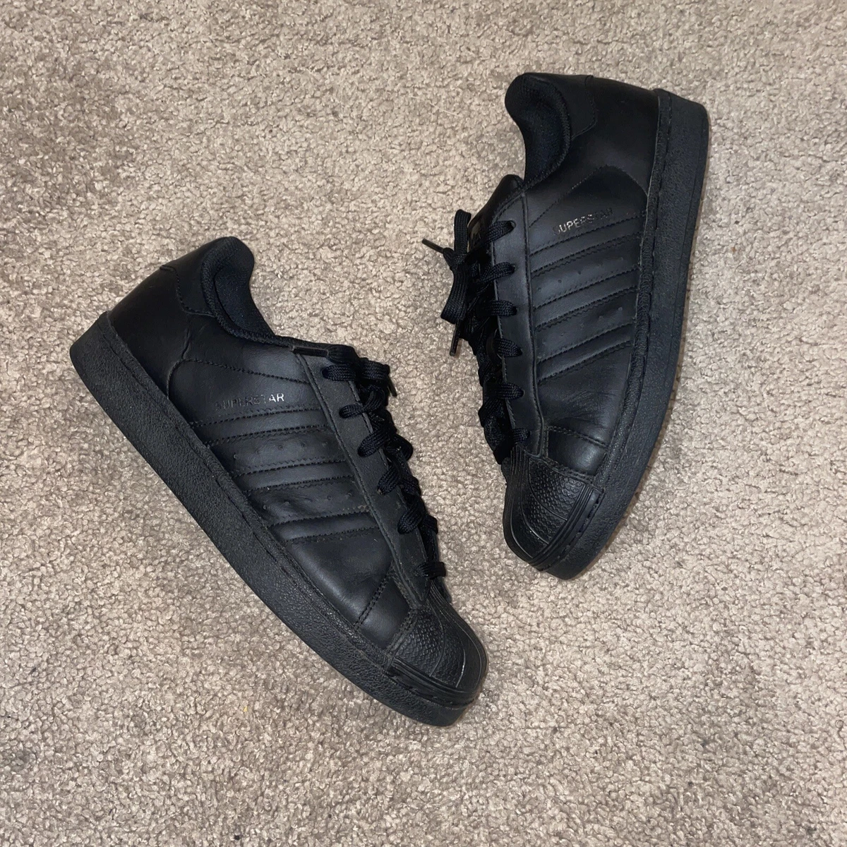 All black top shell toe adidas