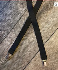Black suspenders more decorative than they are strong 