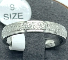Ring. Silver Tone Band with glitzy silver look all round.  1/4 In band. Size 9