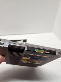 Teenage Mutant Ninja Turtles (Nintendo NES, 1989) con manuale