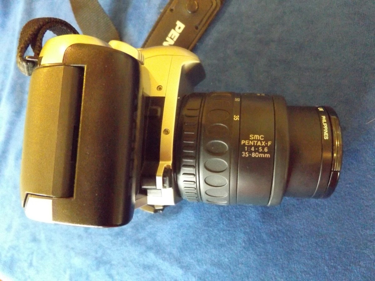 Pentax ZX-50 35 mm film camera, Strap, Lens Cover, Hoya 49 mm UV