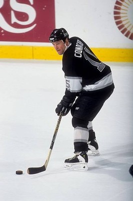 Pat Conacher Los Angeles Kings skates with the puck at an NHL game- Old Photo